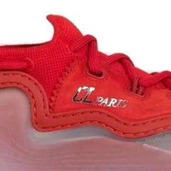 A close-up of a red athletic shoe showing the side panel with 'UL PARIS' text in metallic lettering, set against a plain white background.