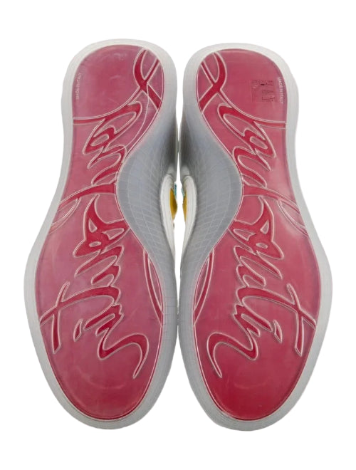 A pair of athletic shoes shown from the bottom, featuring a vibrant pink and red gradient sole with white script lettering and a white midsole.