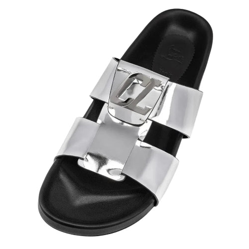 Black slide sandal with silver buckle on a white background