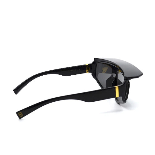 Black sunglasses with gold accents on a white background