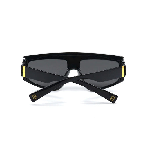 Black sunglasses with gold accents on a white background