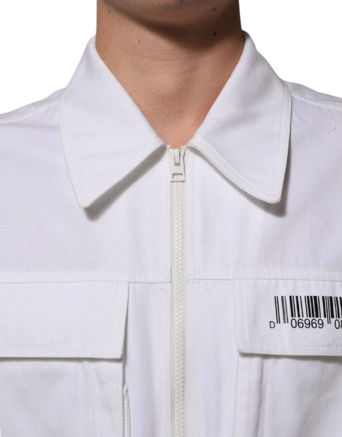 Close-up of a white shirt with a zipper, showing part of a person's chest.