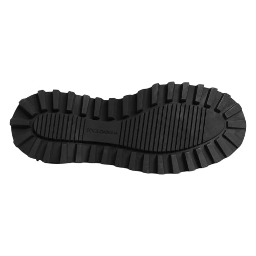 Black sole of a shoe with 'Dolce & Gabbana' branding on a white background