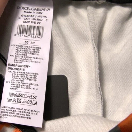 Dolce & Gabbana label on a garment with visible text and symbols.