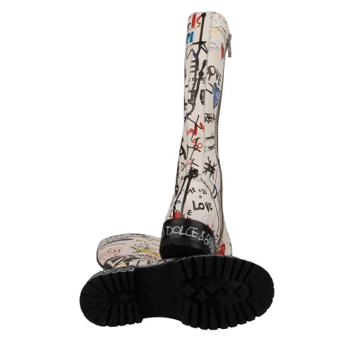 White knee-high boot with black sole and colorful designs on a white background