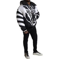 Person wearing a zebra-striped jacket on a white background