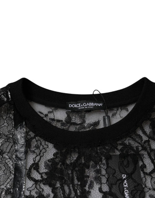 Dolce & Gabbana label on a black lace garment with a white background