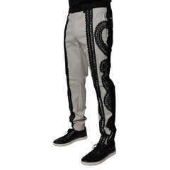 Light gray pants with black decorative patterns on a white background