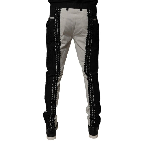 White pants with black sequin stripes on a white background