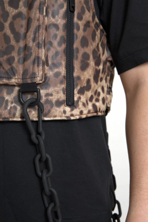 Leopard print vest with black chain detail on a plain background