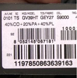 Close-up of a product with a barcode and text on a dark background