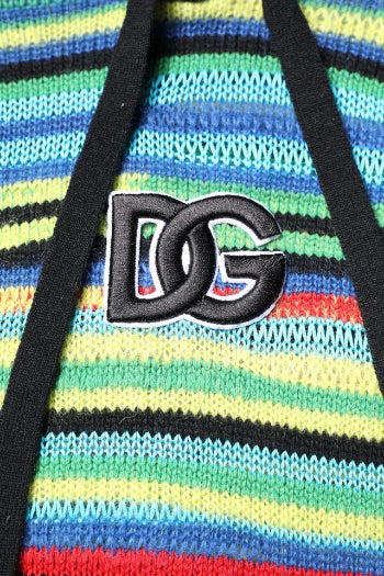 Colorful striped bag with a black logo on a multicolored background
