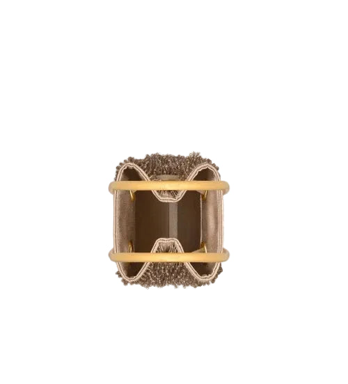 A small gold-toned geometric charm with a clear faceted dome center, shown on a plain white background.