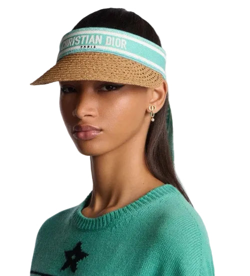 Woman wearing a visor with a blurred background