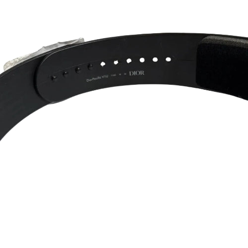 Black belt with 'Dior' branding on a white surface