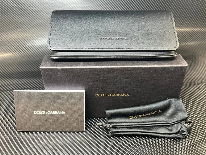 Dolce & Gabbana wallet with packaging on a textured surface