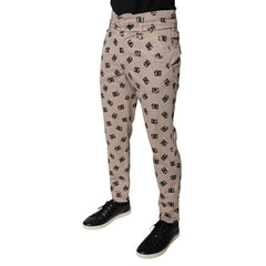 Beige pants with a pattern worn by a person on a white background