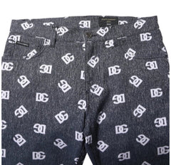 Dark jeans with a white logo pattern on a white background