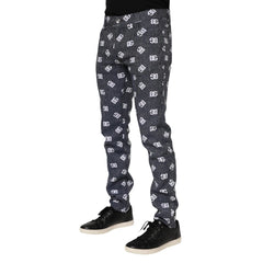 Dark gray pants with a pattern worn by a person on a white background