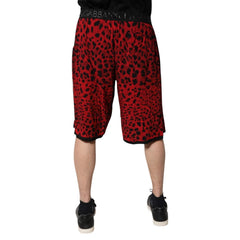 Red leopard print shorts worn by a person on a white background
