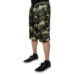 Camouflage shorts worn by a person on a white background