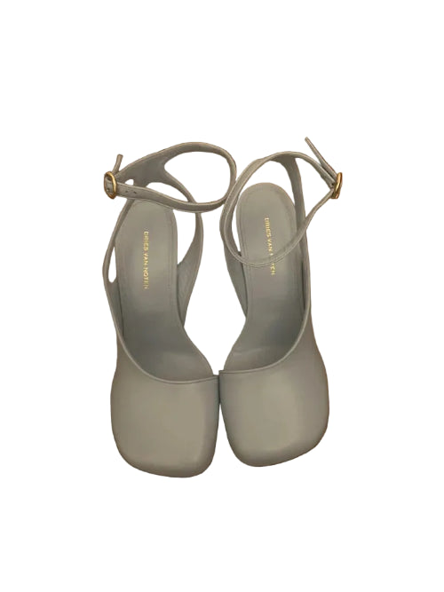 Pair of gray sandals on a wooden floor