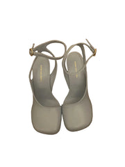 Pair of gray sandals on a wooden floor