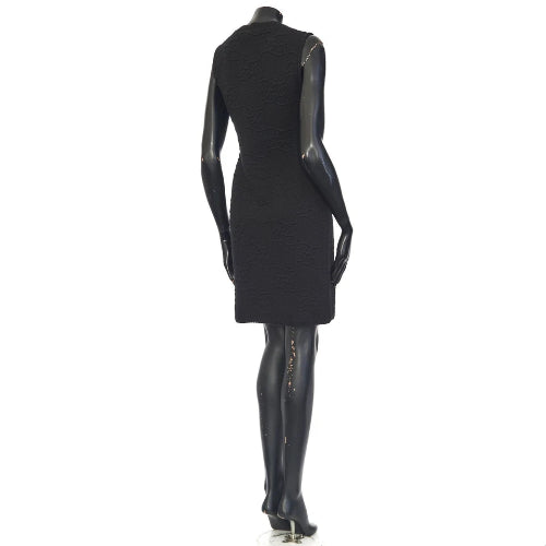 Black dress on a mannequin against a white background