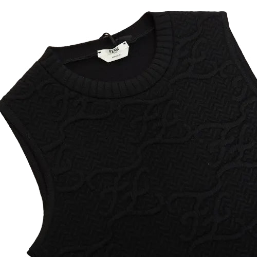 Black sweater on a wooden surface