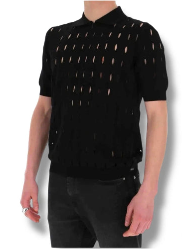 Person wearing a black outfit with gold patterns on a white background