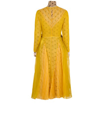 Yellow dress on a mannequin against a white background
