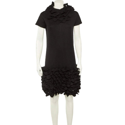 Black dress with ruffled skirt on a white background
