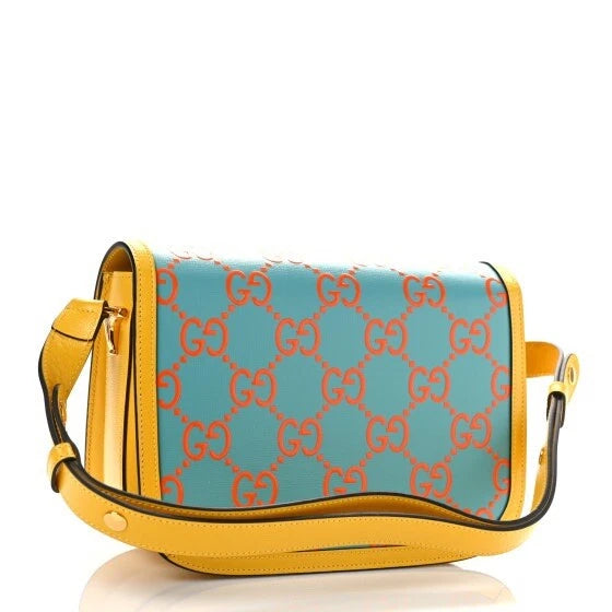 Designer handbag with blue and orange pattern on a white background