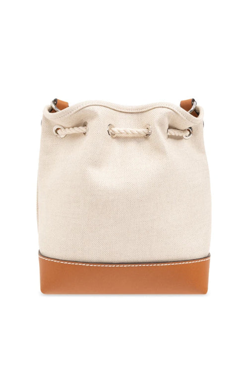 Beige bucket bag with brown leather trim on a white background