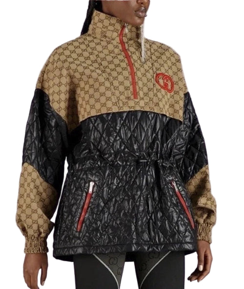 Person wearing a black and beige jacket with Gucci logo on a white background