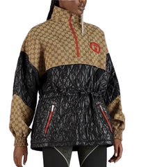 Person wearing a black and beige jacket with Gucci logo on a white background