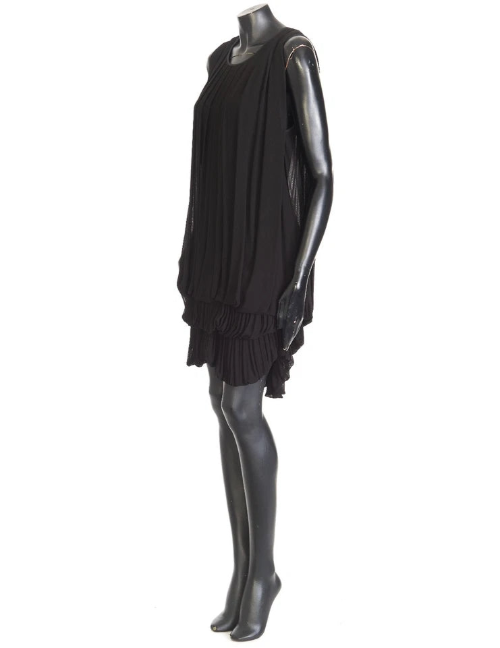 Black dress on a mannequin against a white background