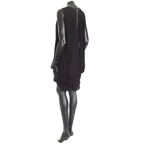 Black dress on a mannequin against a white background