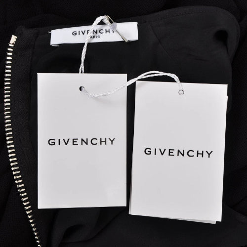Givenchy shopping bags and clothing tag on a black background