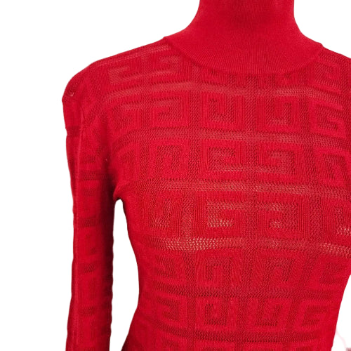 Red knitted sweater with geometric pattern on a light gray background