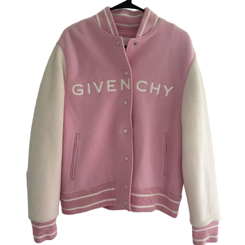 Pink and white Givenchy jacket on a hanger against a white background