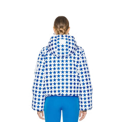 Person wearing a blue and white star-patterned jacket on a white background