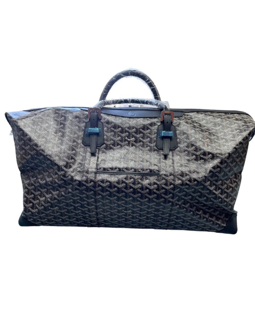 A dark navy blue woven leather tote bag with a top handle, shown against a plain white background.