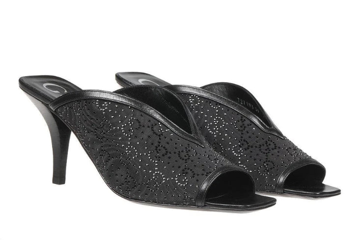 Black open-toe high-heeled shoes with glittery texture on a white background