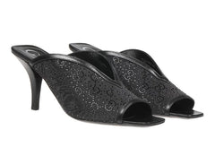 Black open-toe high-heeled shoes with glittery texture on a white background