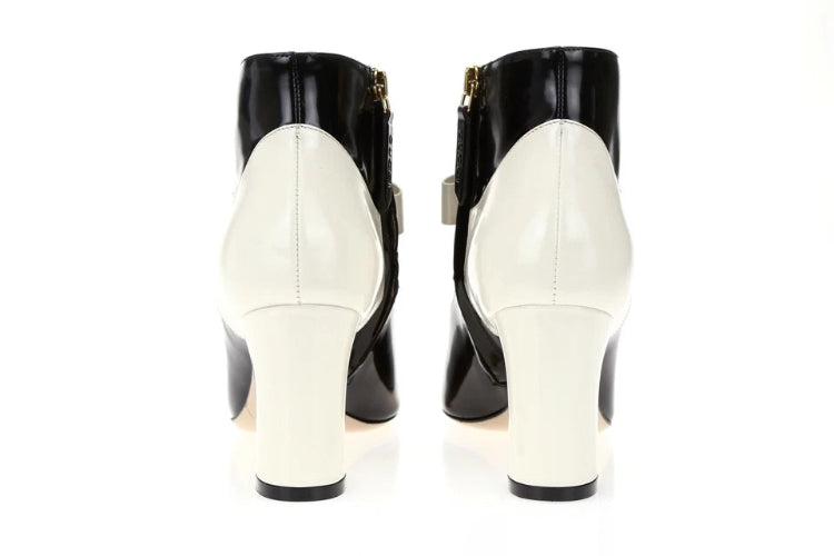 Black and white high-heeled shoes on a white background