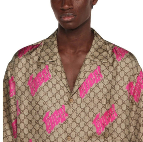 Man wearing a patterned shirt with pink accents