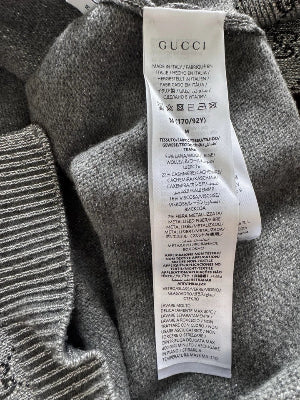 Gucci label on a textured fabric background