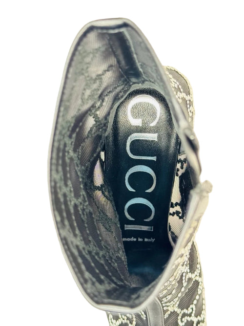 Gucci handbag with brand logo on a beige background