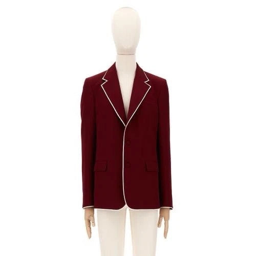 Red blazer with white trim on a mannequin against a white background